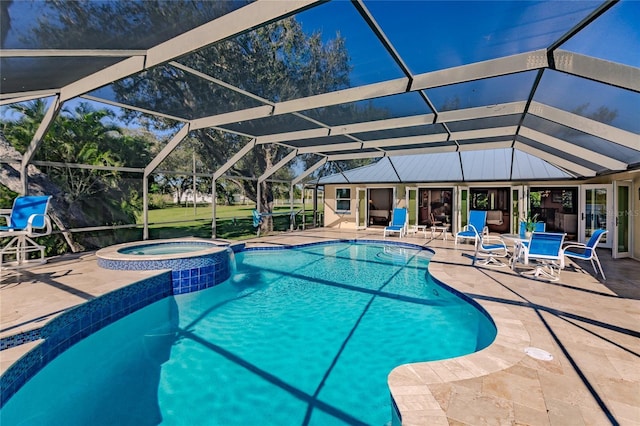 view of swimming pool featuring an in ground hot tub, a lanai, and a patio area