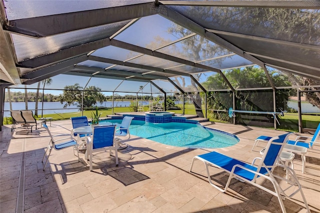 view of pool with glass enclosure, a water view, an in ground hot tub, and a patio