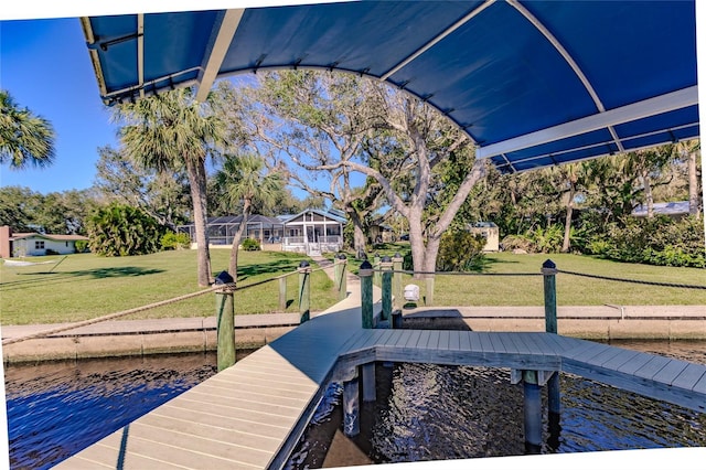 dock area featuring a water view and a lawn