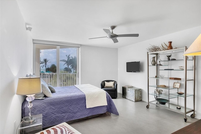 bedroom with ceiling fan and access to outside