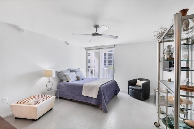 bedroom featuring ceiling fan and floor to ceiling windows