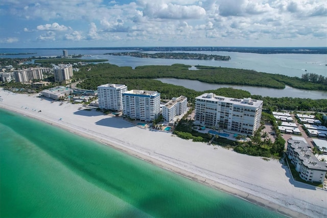 birds eye view of property with a view of the beach and a water view