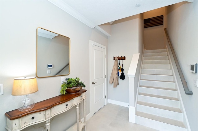 entrance foyer featuring crown molding