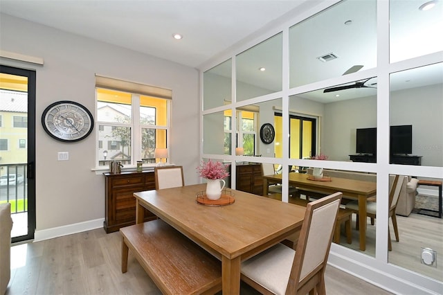 dining area with light hardwood / wood-style flooring