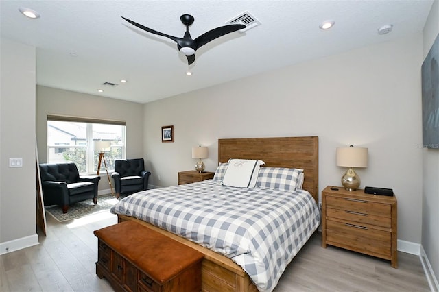 bedroom featuring ceiling fan and light hardwood / wood-style floors