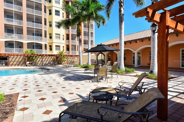 view of pool featuring a pergola and a patio area