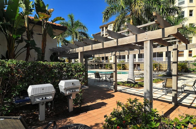 view of patio featuring a pergola and a community pool