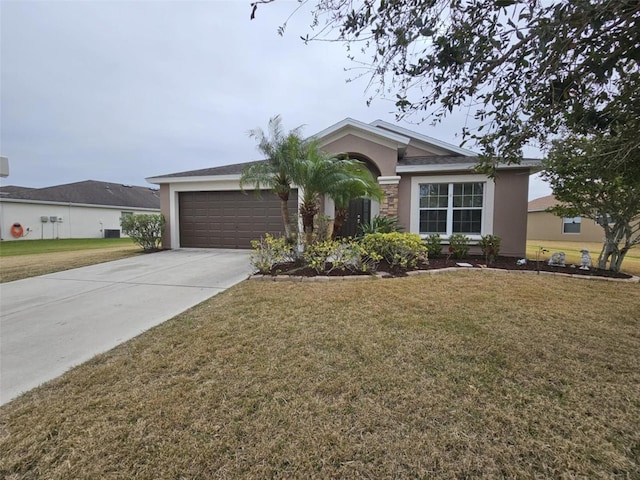 ranch-style house featuring a front lawn and a garage