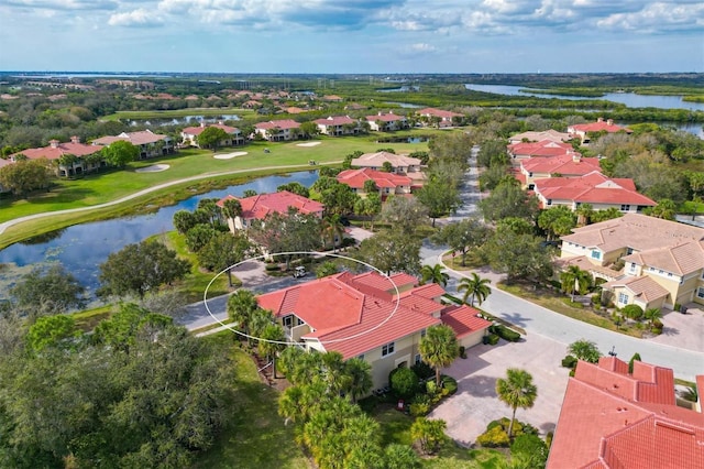 drone / aerial view featuring a water view and a residential view