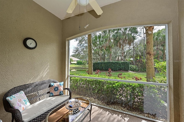 sunroom featuring ceiling fan