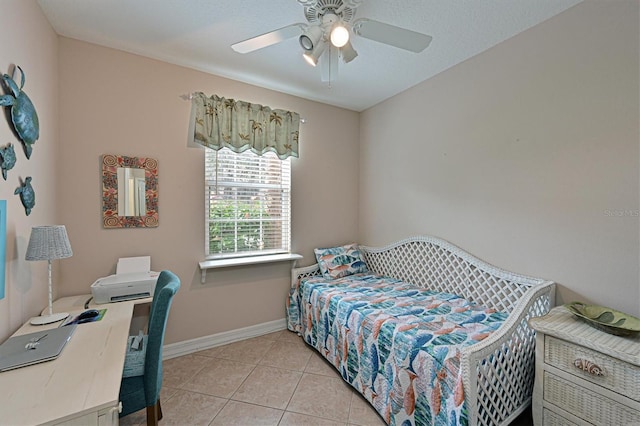 bedroom featuring ceiling fan and light tile patterned floors