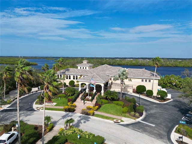 birds eye view of property with a water view