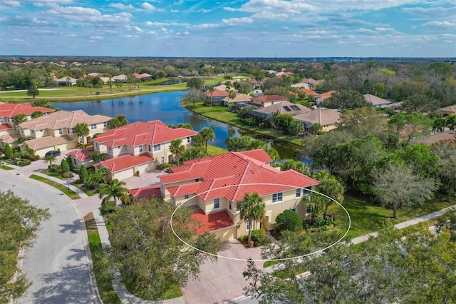 birds eye view of property with a residential view and a water view