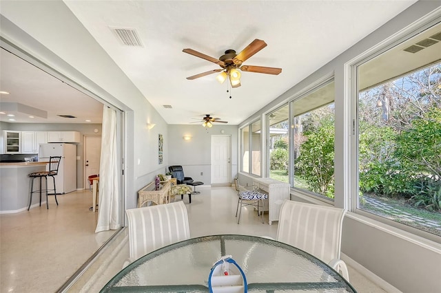 sunroom / solarium with ceiling fan