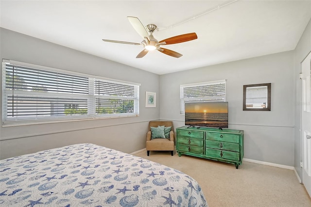 bedroom with ceiling fan and light colored carpet