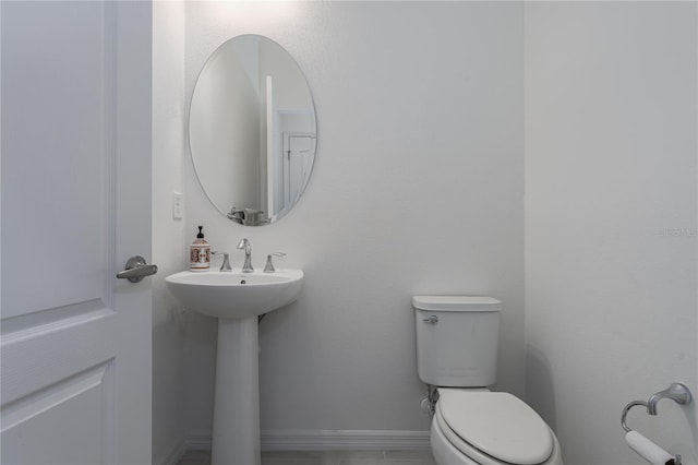 bathroom featuring sink and toilet