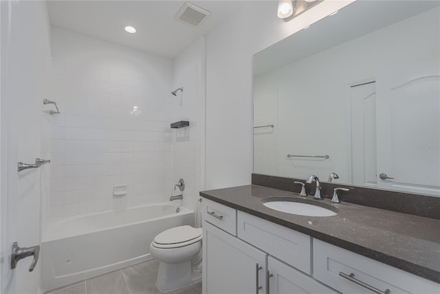 full bathroom featuring tiled shower / bath, tile patterned flooring, vanity, and toilet