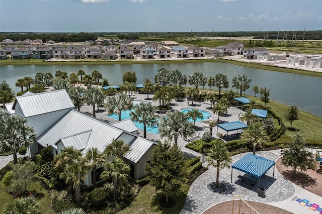 birds eye view of property with a water view