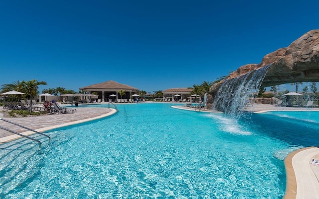 view of pool featuring pool water feature