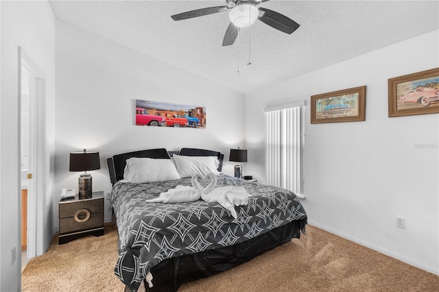 bedroom featuring ceiling fan, a textured ceiling, light carpet, and vaulted ceiling