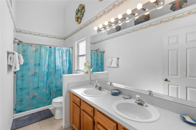 bathroom featuring toilet, vanity, tile patterned flooring, and a shower with shower curtain