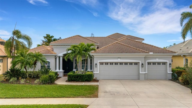 mediterranean / spanish house with a garage