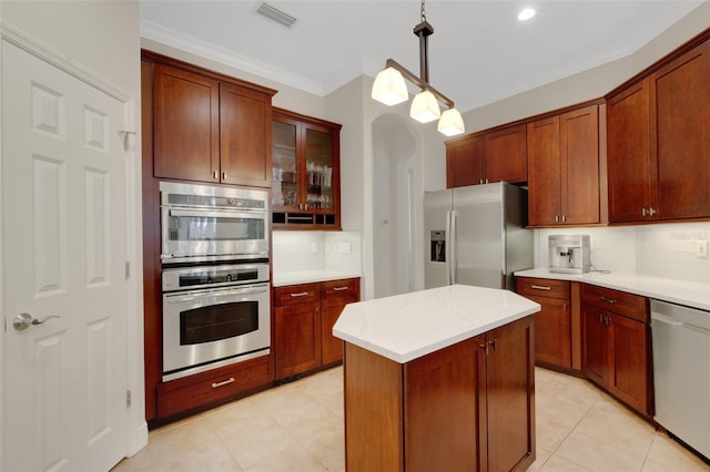 kitchen featuring tasteful backsplash, a center island, crown molding, hanging light fixtures, and stainless steel appliances