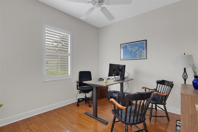 office with ceiling fan and wood-type flooring