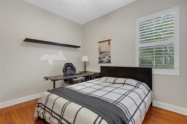 bedroom featuring ceiling fan and wood-type flooring