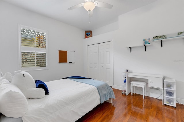 bedroom with ceiling fan, hardwood / wood-style floors, and a closet