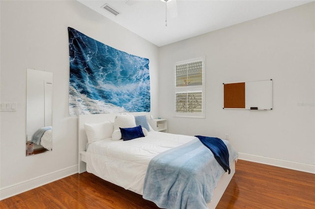 bedroom with ceiling fan and wood-type flooring