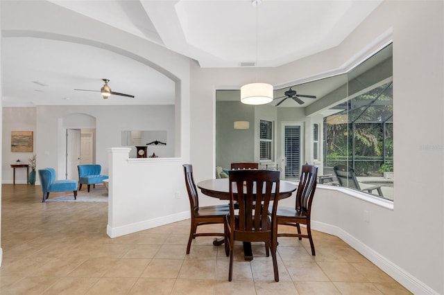 dining space featuring ceiling fan and light tile patterned flooring