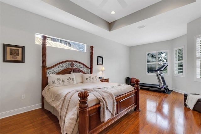 bedroom with ceiling fan and hardwood / wood-style flooring