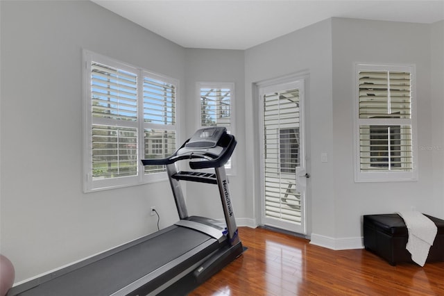 workout area with hardwood / wood-style flooring