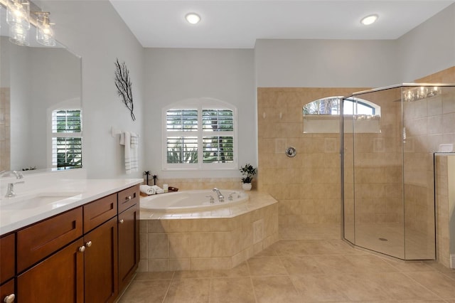 bathroom featuring tile patterned floors, vanity, and independent shower and bath