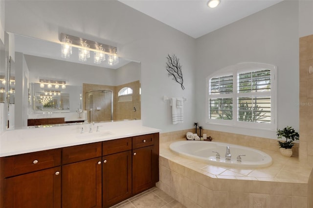 bathroom with tile patterned floors, vanity, and plus walk in shower