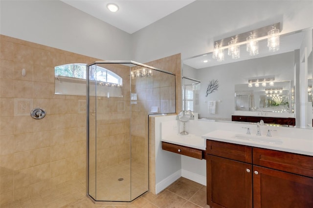 bathroom with vanity, tile patterned floors, and tiled shower