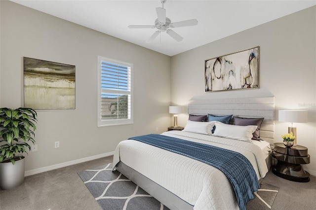 bedroom with ceiling fan and light carpet