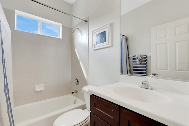 full bathroom featuring toilet, vanity, and shower / bath combo with shower curtain