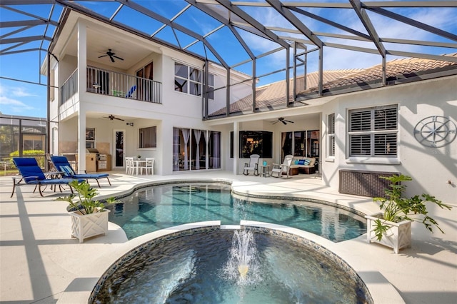 view of pool with ceiling fan, a patio area, an in ground hot tub, and a lanai