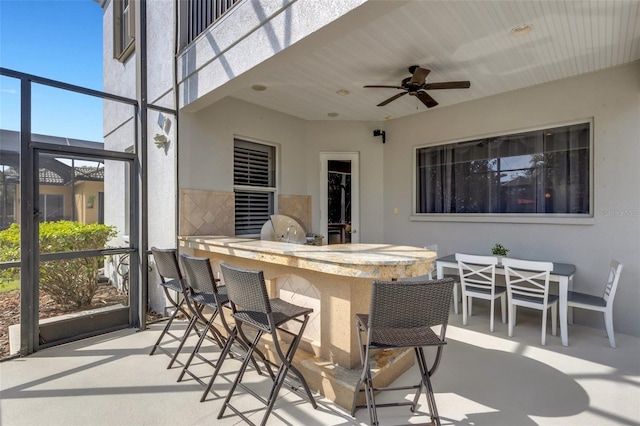 sunroom / solarium with ceiling fan