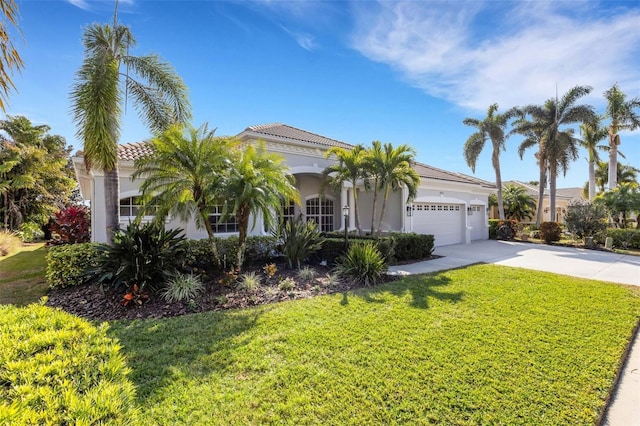 view of front facade with a front yard and a garage