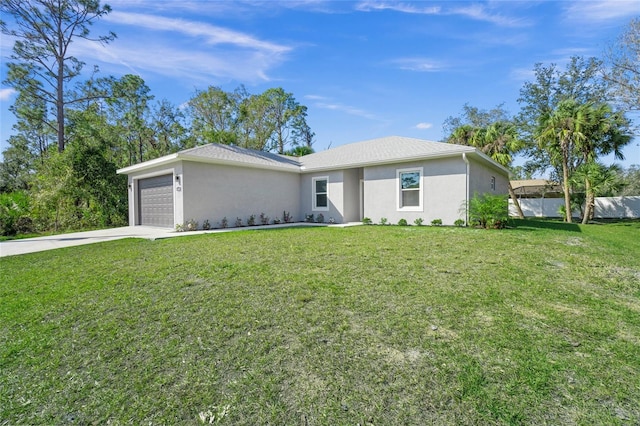 ranch-style house featuring a front yard and a garage