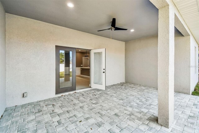 view of patio featuring ceiling fan