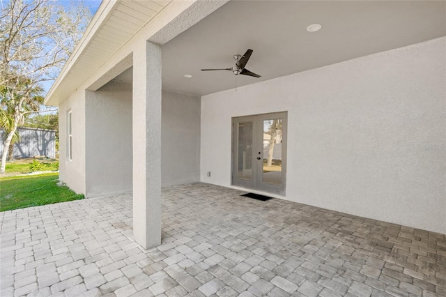 view of patio with french doors and ceiling fan