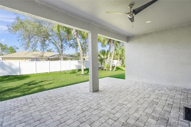 view of patio featuring ceiling fan