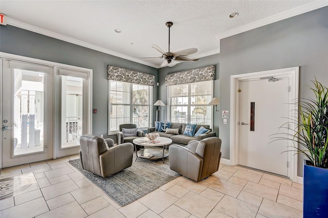 living area featuring light tile patterned floors, ceiling fan, a textured ceiling, and crown molding