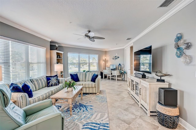 living room featuring a textured ceiling, visible vents, baseboards, a ceiling fan, and ornamental molding