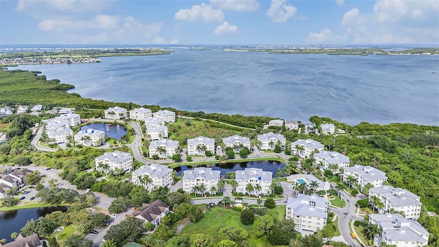 birds eye view of property with a residential view and a water view