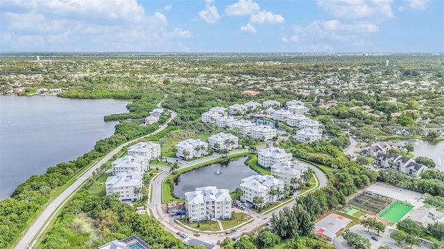 birds eye view of property with a water view and a residential view